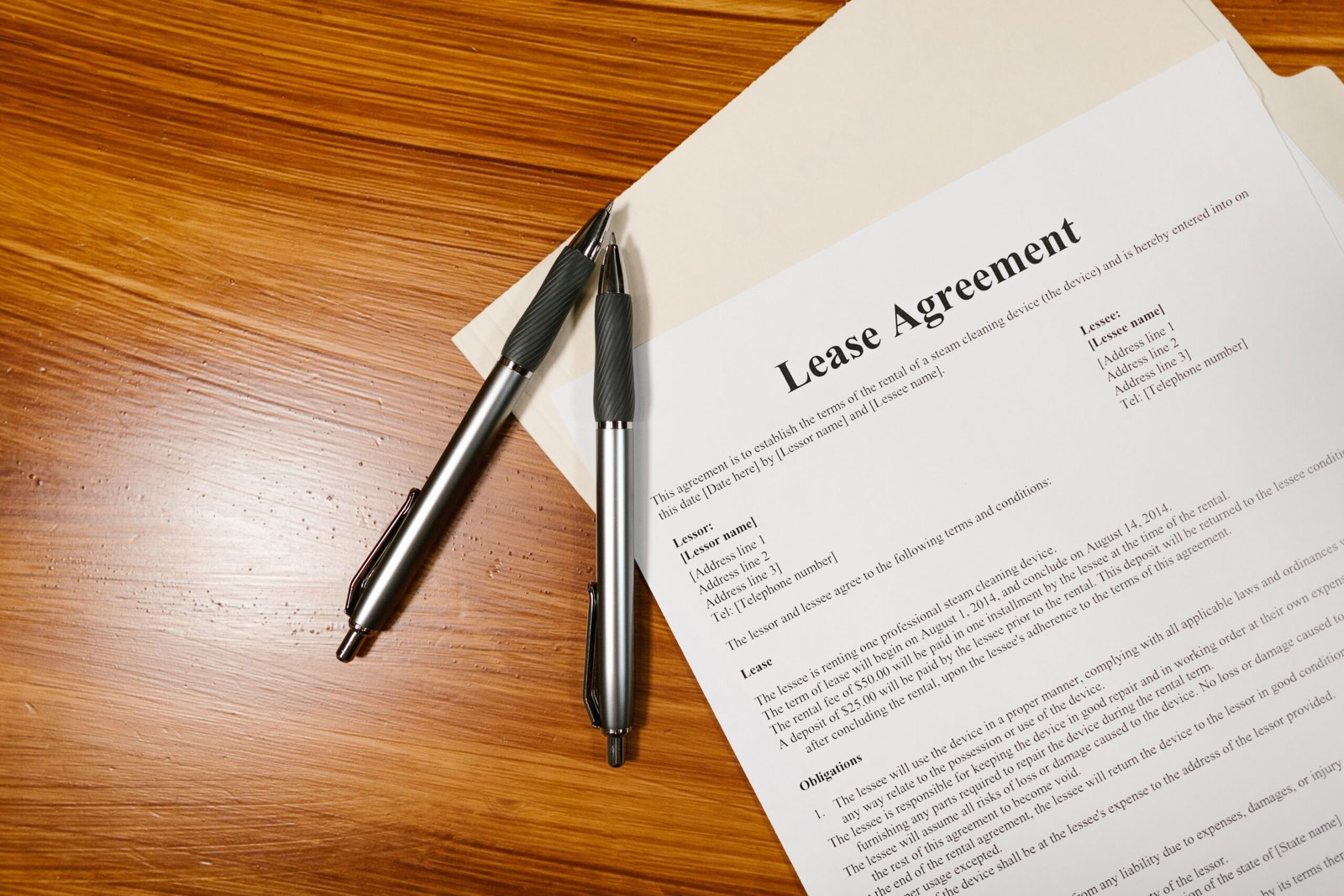 Lease agreement and paperwork on a desk representing New York security deposit law