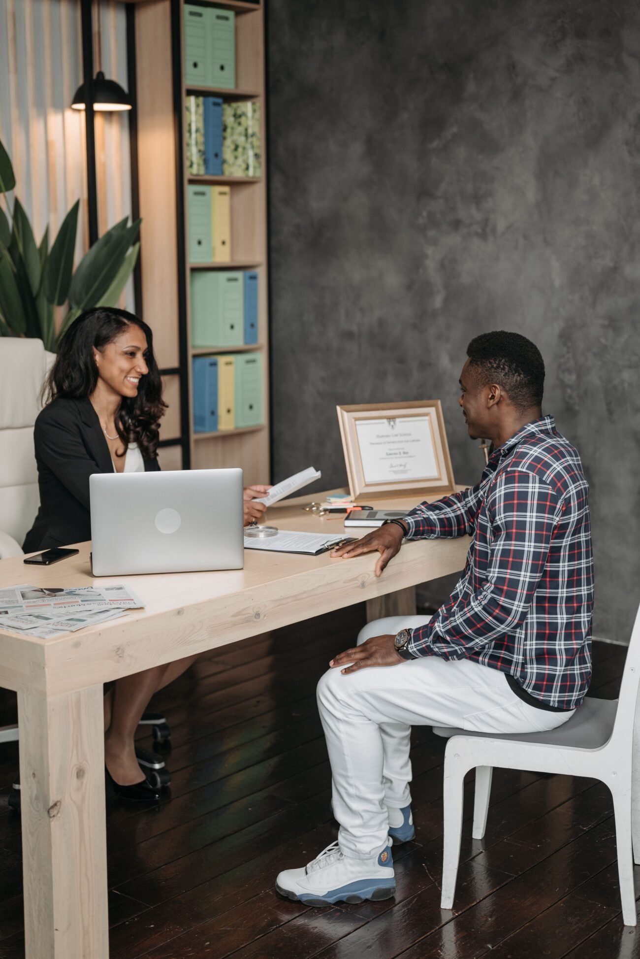 A client meeting with a professional in an office, illustrating a legal consultation