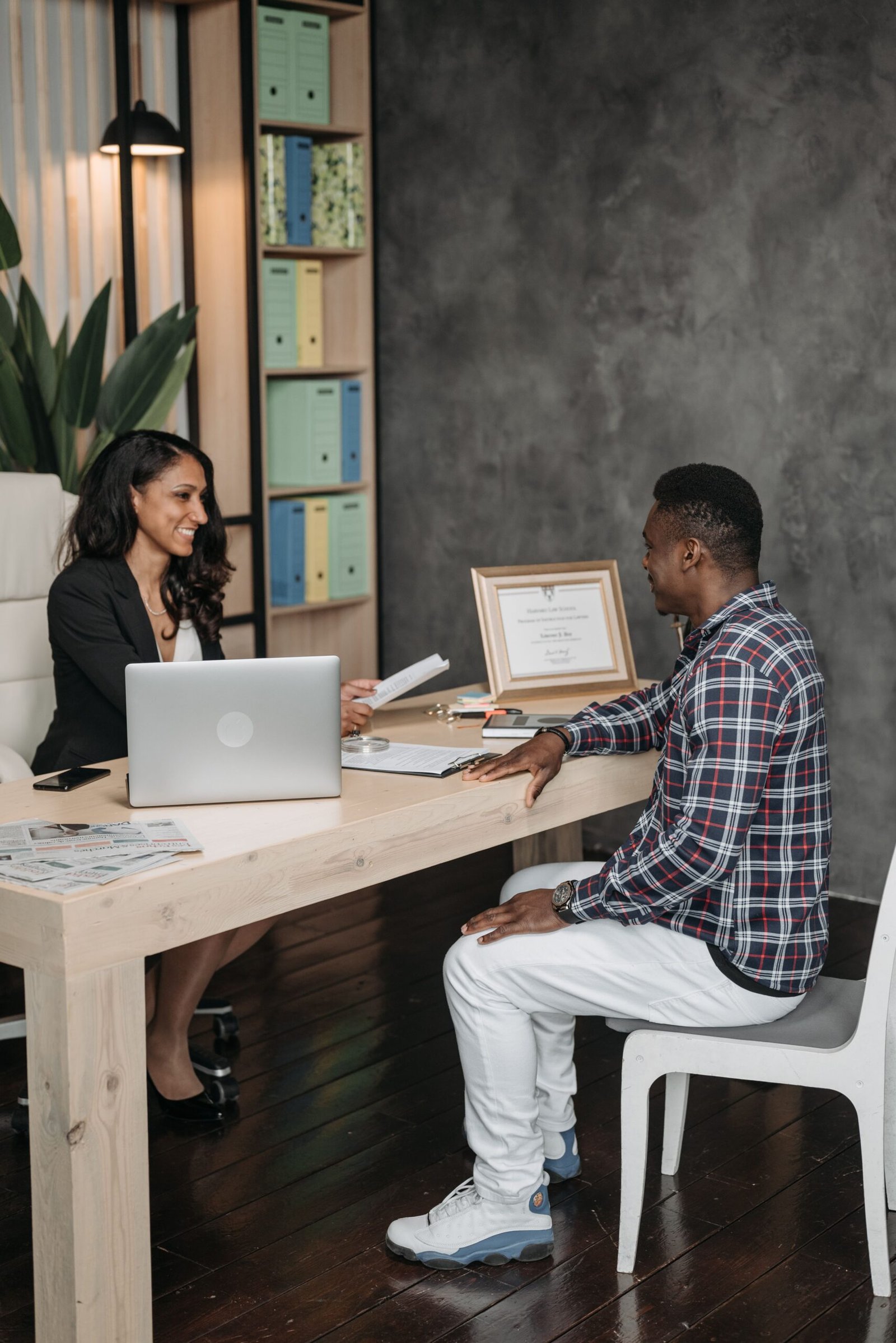 A client meeting with a professional in an office, illustrating a legal consultation